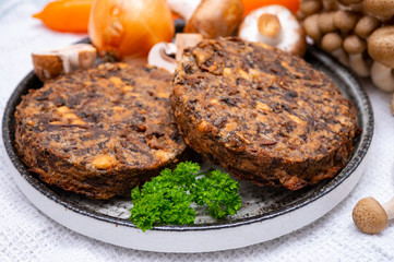 Tasty vegetarian food, burgers with champignons mushrooms, buna shimeji, carrot and onion