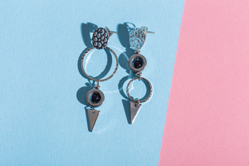 Top view of fashion jewelry and accessories on bright color background. Luxurious jewelry...