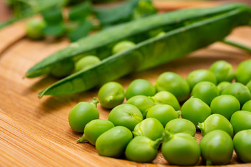 New harvest of ripe green peas legumes