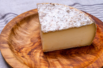 Cheese tomme de montagne or tomme de savoie made from cow milk in French Alps.