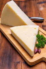 Pieces of matured pecorino romano italian cheese made from sheep milk in Lazio, Sardinia or Tuscany