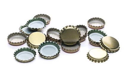 Bottle caps pile isolated on white background