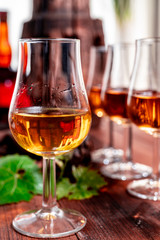 Tasting of aged french cognac brandy in old cellars of cognac-producing regions Champagne or Bois, France