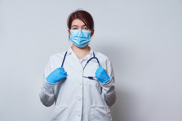 Doctor wearing surgical face mask and gloves.