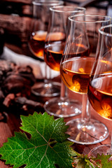 Tasting of aged french cognac brandy in old cellars of cognac-producing regions Champagne or Bois, France