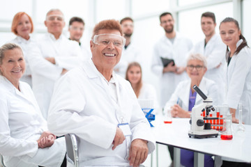 portrait of a successful supervisor and his team in the laboratory .