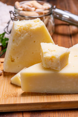 Pieces of matured pecorino romano italian cheese made from sheep milk in Lazio, Sardinia or Tuscany