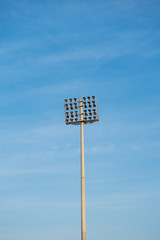 floodlight, spot light, pole Stadium Lights with blue sky.