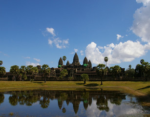 Fototapeta na wymiar Angkor wat reflection in the lake with clear blue sky and white cloudy