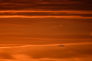 Plane landing at sunrise