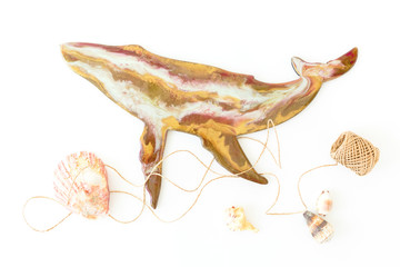 Resin art whale with sea shells and twine on white background. Flat lay
