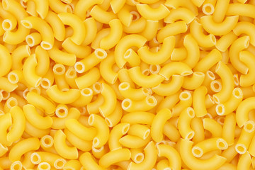 Background from pasta. Horns. Natural product. Close-up. Concept for food advertising.