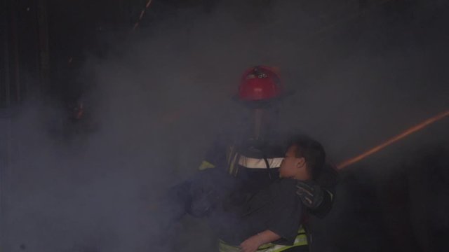 A Firefighter Help and Safety a Little Boy