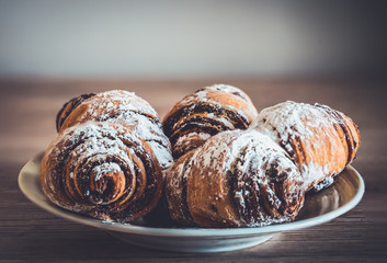 Plate with small chocolate filled croissants