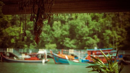 Boats parked by the river as net hanging