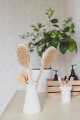 Fototapeta na wymiar Wooden brushes in the bathroom