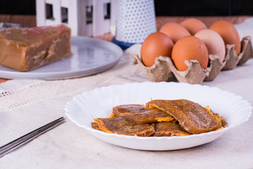 Chinese new year's cake is a food prepared from glutinous rice flour and consumed in Chinese cuisine also known as tikoy or nian gao; in the Philippines they cover it with egg