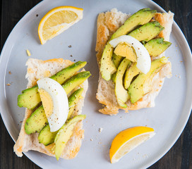 a Filipino bread with toasted garlic butter topped with avocado and egg also known as avocado toast