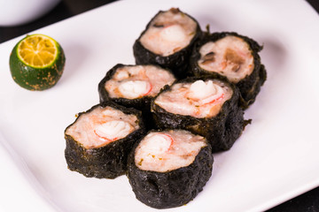 a Philippine made Japanese siomai; ground pork with crab stick wrapped in nori 