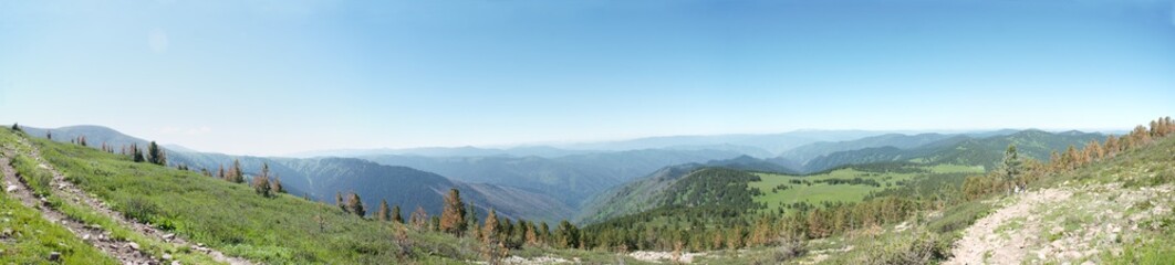 Obraz premium Panorama of mountain peaks extending to the horizon