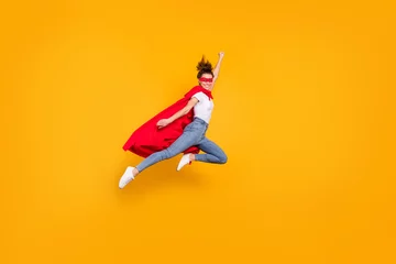 Foto op Canvas Full length body size view of her she nice attractive lovely strong powerful fit slim cheerful girl jumping wearing mantle flying fast isolated on bright vivid shine vibrant yellow color background © deagreez