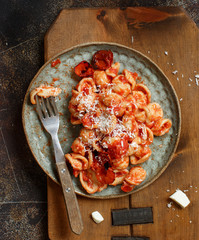 South italian  pasta orecchiette with tomato sauce and cacioricotta cheese