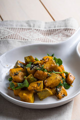 sweet and salty baked pumpkin with fresh rosemary and arugula 