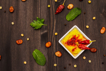 Hummus, healthy vegan (vegetarian) food. Edamame dry beans, fresh leaves, spices