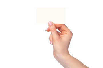 Fototapeta premium Beautiful female hand holding white business card on white background