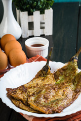 smoked eggplant fried in egg with ketchup, also known as tortang talong; famous Filipino staple...