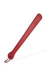 Detailed shot of a long red leather paddle with a smooth surface and a thin leather loop on the handle. The tool for erotic games is isolated on the white background. 