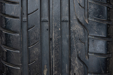 Closeup up of tyre tread from a car wheel showing worn marks