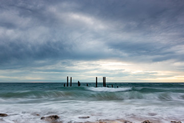 The iconic port willunga jetty ruins at high tide and long exposures located on the Fleurieu Peninsula South Australia on the 26th May 2020