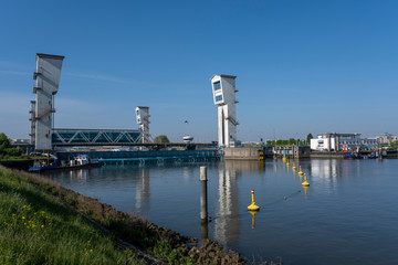 the Algera flood barrier in the river Hollandse IJssel in the background on a sunny day in...
