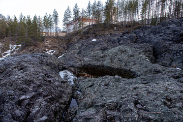 Water flows into the old crater of an extinct prehistoric volcano