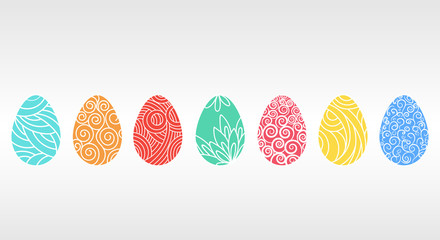 Seven multi-colored Easter eggs with different patterns