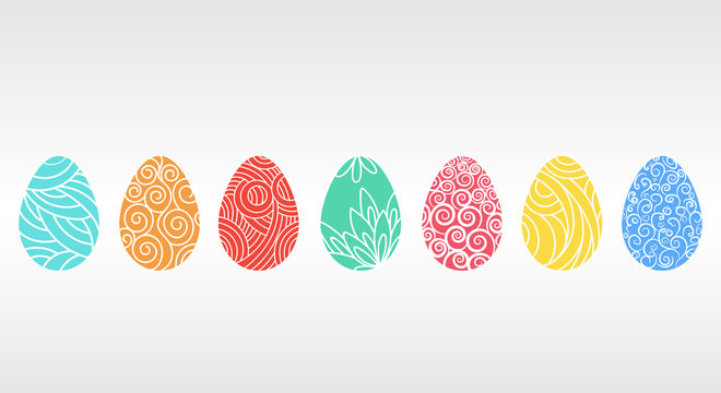 Seven multi-colored Easter eggs with different patterns
