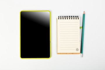 Digital Tablet mockup and stationery on a white table. Flat lay.