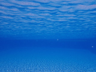 Fototapeta na wymiar Swimming pool underwater