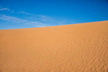 Ripple sand dunes and blue sky background, Perry Sandhills, Australia