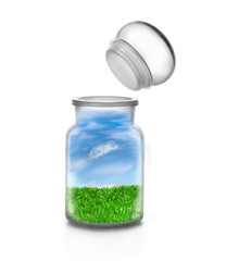 Green lawn landscape into a bottle and opened topper. Environmental concept