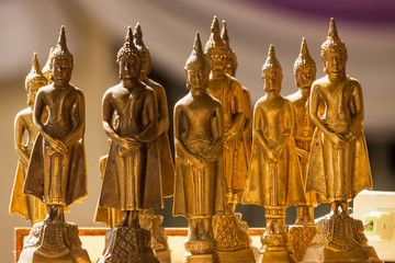 Array of beautiful golden buddha statues in Temple, Thailand ’s religious belief.