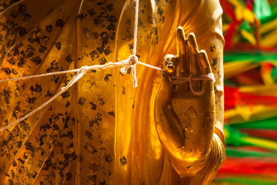 Hand of golden Buddha