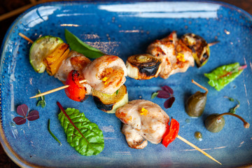 grilled meat and vegetables on wooden skewers