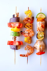 seafood meat bacon grilled vegetables on wooden skewers