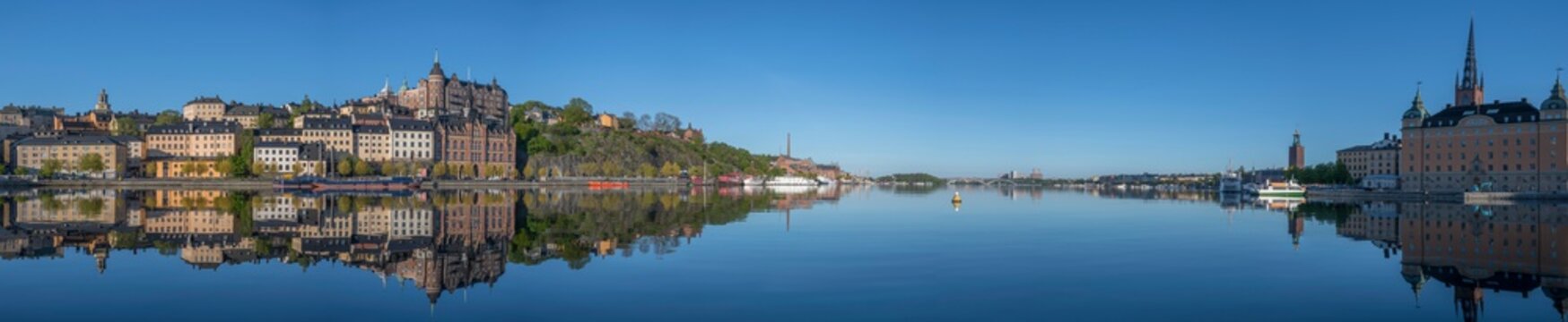 Sunny morning view over old house part of the district of S&ouml;dermalm, above the waterfront at the bay Riddarfj&auml;rden and the sluice part in Stockholm. 