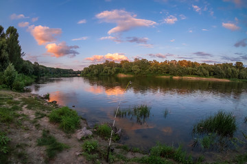 Obraz premium .Fishing at sunset time on a fishing rod.