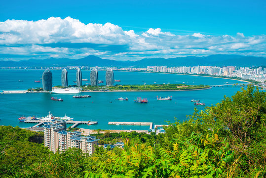 Sanya city, Hainan island. Aerial view of Phoenix Island from Luhuitou Park. Excellent tourism destination for summer vacation by the sea. Popular Chinese resort. Paradise island.