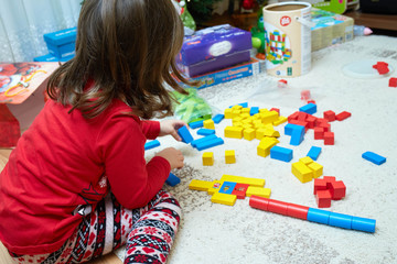 little girl playing with blocks