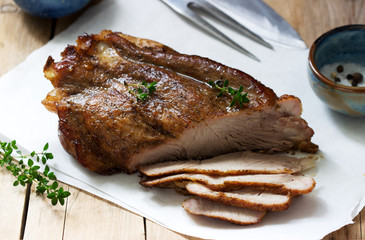 Baked pork shoulder on the bone with spices, herbs and aromatic oil.